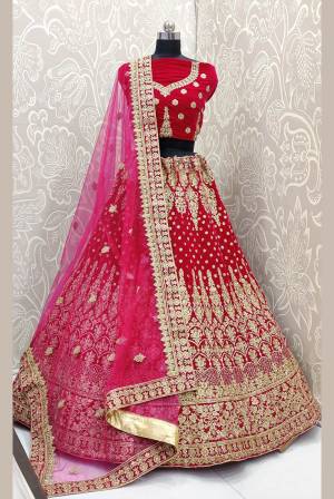 Look Pretty In This Every Girl's Favourite Color For Bridal Wear In All Over  Rani Pink Colored Lehenga Choli. This Very Beautiful Heavy Designer Lehenga Choli Is Fabricated on Velvet Paired With Net Fabricated Dupatta. Buy Now. Its Attractive Embroidery And Color Will Definitlely Earn You Lots Of Compliments From Onlookers.