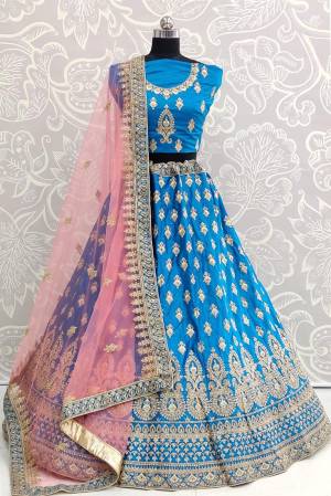 Look Pretty In This Very Beautiful And Heavy Designer Lehenga Choli In Blue Color Paired With Contrasting Baby Pink Colored Dupatta. Its Heavy Embroidered Blouse And Lehenga Are Fabricated On Satin Silk Paired With Net Fabricated Dupatta. Buy Now.