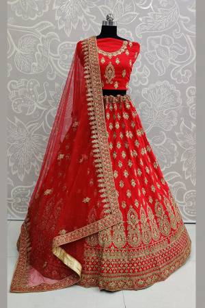 Catch All The Limelight At The Next Wedding You Attend Wearing This Heavy Designer Lehenga Choli In All Over Red Color. This Lehenga Choli Is Satin Silk Based Paired With Net Fabricated Dupatta.