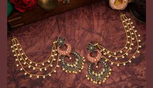 Grab This Heavy Designer Earrings For The Upcoming Wedding Season. The New Trendy And Designer Earrings Can Be Paired With Any Kind Of Ethnic Attire. Also It Will Earn You Lots Of Compliments From Onlookers. 