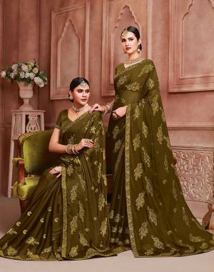 Enhance Your Personality Wearing This Designer Saree In Olive Green Color. This Pretty Resham Embroidered Saree Is Fabricated On Chiffon Paired With Art Silk Fabricated Blouse. It Is Highlited With Pretty Stone Work Which Gives An Attractive Yet Elegant Look.