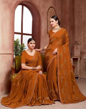 Enhance Your Personality Wearing This Designer Saree In Brown Color. This Pretty Resham Embroidered Saree Is Fabricated On Chiffon Paired With Art Silk Fabricated Blouse. It Is Highlited With Pretty Stone Work Which Gives An Attractive Yet Elegant Look.