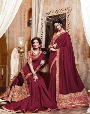 Celebrate This Festive Season With Beauty And Comfort Wearing This Simple And Elegant Looking Designer Saree In Maroon Color. This Saree Is Silk Based Paired With Jacquard Silk Fabricated Blouse