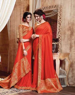 Celebrate This Festive Season With Beauty And Comfort Wearing This Simple And Elegant Looking Designer Saree In Orange Color. This Saree Is Silk Based Paired With Jacquard Silk Fabricated Blouse