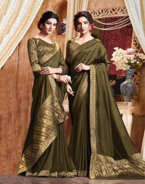 Add Some Rich And Elegant looking Simple Yet Designer Saree In Olive Green Color. This Saree Is Fabricated On Art Silk Paired with Jacquard Silk Fabricated Blouse. Buy Now.