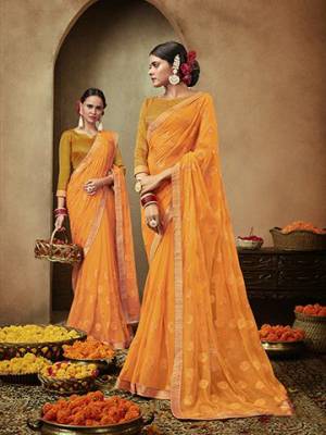 Pretty Simple And Elegant Looking Designer Saree Is Here In Orange Color. This Pretty Motif Embroidred Saree Is Chiffon Based Paired with Brocade Fabricated Blouse. Buy This Pretty Saree Now.