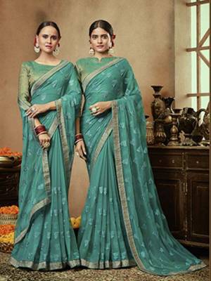 Pretty Simple And Elegant Looking Designer Saree Is Here In Sea Blue Color. This Pretty Motif Embroidred Saree Is Chiffon Based Paired with Brocade Fabricated Blouse. Buy This Pretty Saree Now.