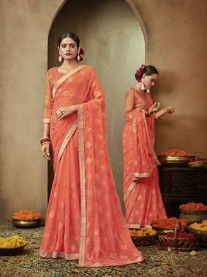 Adorn The Pretty Angelic Look Wearing This Designer Saree In Dark Peach Color. This Saree IS Fabricated On Chiffon Paired With Brocade Fabricated Blouse. Buy Now.
