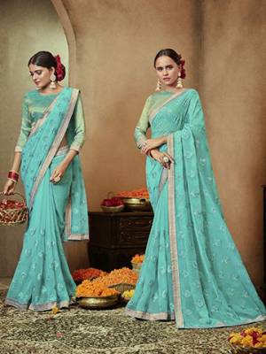 Pretty Simple And Elegant Looking Designer Saree Is Here In Turquoise Blue Color. This Pretty Motif Embroidred Saree Is Chiffon Based Paired with Brocade Fabricated Blouse. Buy This Pretty Saree Now.