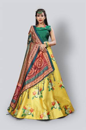 Celebrate This Festive Season With Beauty And Comfort Wearing This Lovely Digital Printed Designer Lehenga Choli In Green Colored Blouse Paired With Yellow Lehenga And Multi Colored Dupatta. This Pretty Blouse And Lehenga Are Satin Silk Based Paired With Assam Silk Fabricated Dupatta. 