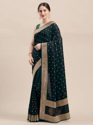 Flaunt Your Rich And Elegant Taste Wearing This Designer Saree In Pine Green Color Paired with Pine Green Colored Blouse. This Detailed Embroidered Saree And Blouse Are Satin Silk Based Which Also Gives A Rich Look To Your Personality. 