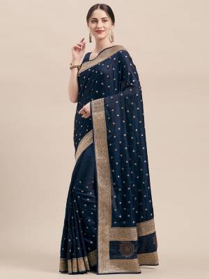 Flaunt Your Rich And Elegant Taste Wearing This Designer Saree In Navy Blue Color Paired with Navy Blue Colored Blouse. This Detailed Embroidered Saree And Blouse Are Satin Silk Based Which Also Gives A Rich Look To Your Personality. 