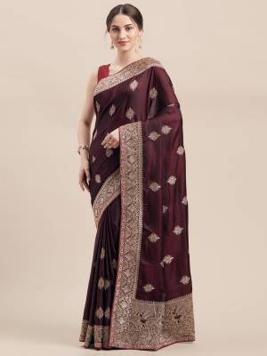 You Will Definitely Earn Lots Of Compliments Wearing This Designer Embroidred Saree In Wine Color Paired With Same Wine Colored Blouse. This Saree And Blouse Are Fabricated On Satin Silk Which Is Light Weight, Durable And Easy To Carry Throughout The Gala. 