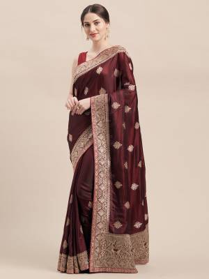 You Will Definitely Earn Lots Of Compliments Wearing This Designer Embroidred Saree In Maroon Color Paired With Same Maroon Colored Blouse. This Saree And Blouse Are Fabricated On Satin Silk Which Is Light Weight, Durable And Easy To Carry Throughout The Gala. 