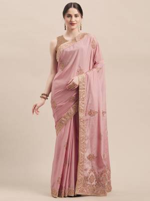 Get Ready For The Upcoming Wedding And Festive Season With This Very Beautiful Designer Saree In Elegant Pink Color Paired With Pink Colored Blouse. This Saree And Blouse Are Fabricated On Chinon Silk Beautified With Jari & Thread Embroidery Highlighted With Stone Work. Its Pretty Elegant Color And Rich Fabric Will Earn You Lots Of Compliments From Onlookers. 