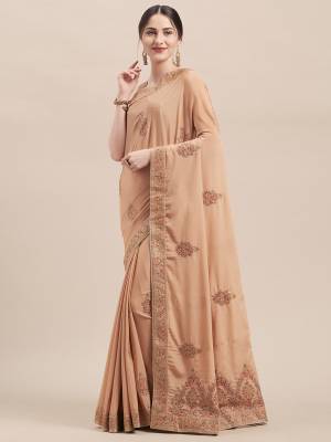 Get Ready For The Upcoming Wedding And Festive Season With This Very Beautiful Designer Saree In Elegant Beige Color Paired With Beige Colored Blouse. This Saree And Blouse Are Fabricated On Chinon Silk Beautified With Jari & Thread Embroidery Highlighted With Stone Work. Its Pretty Elegant Color And Rich Fabric Will Earn You Lots Of Compliments From Onlookers. 