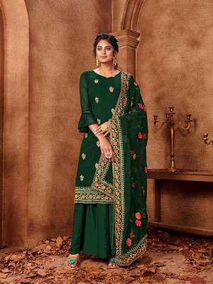 Celebrate This Festive Season With Beauty And Comfort In This Designer Straight Suit In All Over Green Color. Its Embroidered Top And Dupatta Are Fabricated On Georgette Paired With Santoon Fabricated Bottom. Get This Semi-Stitched Suit Now.