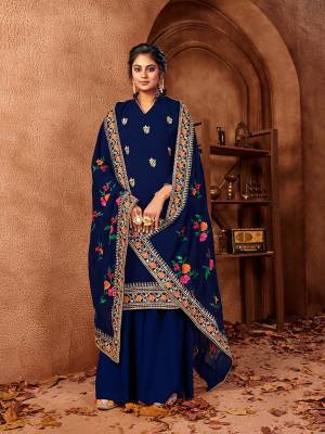 Celebrate This Festive Season With Beauty And Comfort In This Designer Straight Suit In All Over Royal Blue Color. Its Embroidered Top And Dupatta Are Fabricated On Georgette Paired With Santoon Fabricated Bottom. Get This Semi-Stitched Suit Now.