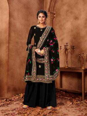 Celebrate This Festive Season With Beauty And Comfort In This Designer Straight Suit In All Over Black Color. Its Embroidered Top And Dupatta Are Fabricated On Georgette Paired With Santoon Fabricated Bottom. Get This Semi-Stitched Suit Now.