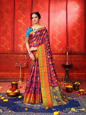 For A Proper Traditional Look, Grab This Checks Patterned Designer Saree In Multi Color Paired With Blue Colored Blouse. This Saree And Blouse Are Fabricated On Art Silk Beautified With Weave. It Is Light In Weight And Easy To Carry All Day Long. 