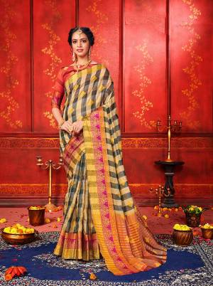 For A Proper Traditional Look, Grab This Checks Patterned Designer Saree In Grey And Beige Color Paired With Red Colored Blouse. This Saree And Blouse Are Fabricated On Art Silk Beautified With Weave. It Is Light In Weight And Easy To Carry All Day Long. 