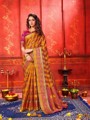 For A Proper Traditional Look, Grab This Checks Patterned Designer Saree In Musturd Yellow Color Paired With Magenta Pink Colored Blouse. This Saree And Blouse Are Fabricated On Art Silk Beautified With Weave. It Is Light In Weight And Easy To Carry All Day Long. 