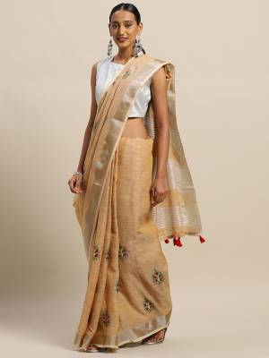 Flaunt Your Rich And Elegant Taste Wearing This Designer Saree In Beige Color Paired With Beige Colored Blouse. This Elegant Looking Saree And Blouse Are Fabricated On Linen Cotton Which Has Rich Feel And Beautified With Thread Embroidery. Buy This Pretty Saree Now.