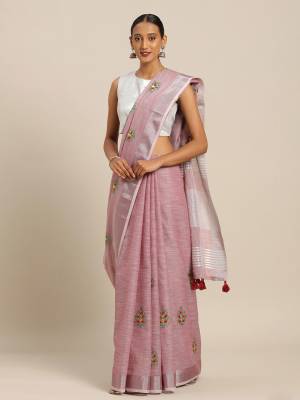 You Will Definitely Earn Lots Of Compliments Wearing This Designer Saree In Pink Color Paired With Pink Colored Blouse. This Pretty Saree And Blouse Are Fabricated On Linen Cotton Beautified With Thread Embroidery. It Is Light In Weight, Durable And Easy To Care For. 