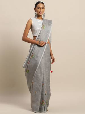 You Will Definitely Earn Lots Of Compliments Wearing This Designer Saree In Grey Color Paired With Grey Colored Blouse. This Pretty Saree And Blouse Are Fabricated On Linen Cotton Beautified With Thread Embroidery. It Is Light In Weight, Durable And Easy To Care For. 