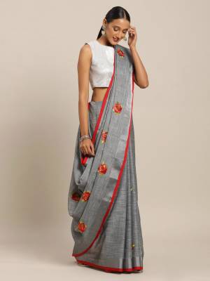 Flaunt Your Rich And Elegant Taste Wearing This Designer Saree In Grey Color Paired With Red Colored Blouse. This Elegant Looking Saree And Blouse Are Fabricated On Linen Cotton Which Has Rich Feel And Beautified With Thread Embroidery. Buy This Pretty Saree Now.