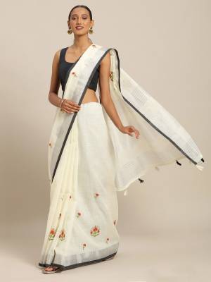 You Will Definitely Earn Lots Of Compliments Wearing This Designer Saree In Off-White Color Paired With Grey Colored Blouse. This Pretty Saree And Blouse Are Fabricated On Linen Cotton Beautified With Thread Embroidery. It Is Light In Weight, Durable And Easy To Care For. 