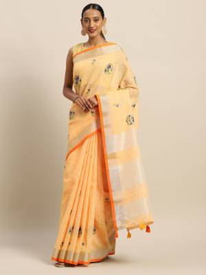 You Will Definitely Earn Lots Of Compliments Wearing This Designer Saree In Yellow Color Paired With Orange Colored Blouse. This Pretty Saree And Blouse Are Fabricated On Linen Cotton Beautified With Thread Embroidery. It Is Light In Weight, Durable And Easy To Care For. 