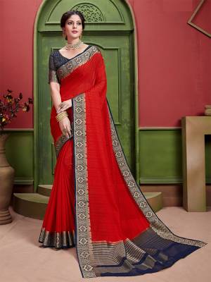 Celebrate This Festive Season Wearing This Rich And Elegant Looking Saree In Red Color Paired With Contrasting Navy Blue Colored Blouse. This Saree And Blouse Are Fabricated On Art Silk Beautified With Weave. 