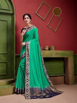 Enahnce Your Personality Wearing This Lovely Designer Saree In Sea Green Color Paired With Contrasting Navy Blue Colored Blouse. This Saree and Blouse Are silk Based Which Gives A Rich Look To Your Personality. 