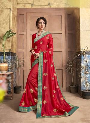 Add This Pretty Simple And Elegant Looking Designer Saree To Your Wardrobe In Red Color. This Saree And Blouse Are Silk Based Beautified With Small Embroidered Motifs. 