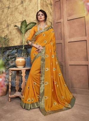 Add This Pretty Simple And Elegant Looking Designer Saree To Your Wardrobe In Musturd Yellow Color. This Saree And Blouse Are Silk Based Beautified With Small Embroidered Motifs. 