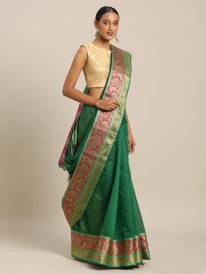 Simple And Elegant Looking Designer Weaved Saree Is Here In Green Color Paired With Contrasting Dark Pink Colored Embroidered Blouse. This Saree And Blouse Are Fabricated On Handloom Silk Which Is Durable, Light Weight And Easy To Care For.