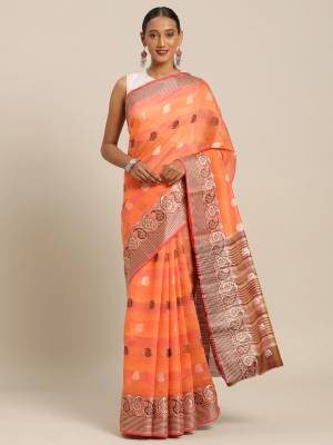 Celebrate This Festive Season With Beauty And Comfort Wearing This Designer Saree In Orange Color Paired with Contrasting Brown Colored Blouse. This Saree and Blouse Are Fabricated On Cotton Handloom Which Gives A Rich Look To Your Personality. 