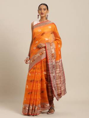 Celebrate This Festive Season With Beauty And Comfort Wearing This Designer Saree In Orange And Yellow Color Paired with Contrasting Brown Colored Blouse. This Saree and Blouse Are Fabricated On Cotton Handloom Which Gives A Rich Look To Your Personality. 