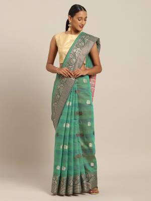 Celebrate This Festive Season With Beauty And Comfort Wearing This Designer Saree In Sea Green Color Paired with Contrasting Brown Colored Blouse. This Saree and Blouse Are Fabricated On Cotton Handloom Which Gives A Rich Look To Your Personality. 