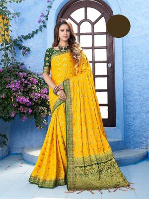 For A Proper Traditional Wear, Grab This Designer Silk Based Saree In Yellow Color Paired With Contrasting Dark Green Colored Blouse. This Saree Is Fabricated On Nylon Crepe Silk Paired With Art Silk Fabricated Blouse. It Is Beautified With Heavy Weave All Over. 