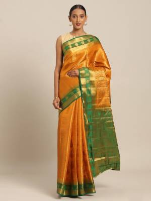 Celebrate This Festive Season Wearing This Pretty Silk Based Saree In Musturd Yellow Paired With Contrasting Green Colored Blouse. This Saree And Blouse Are Fabricated On Art Silk Beautified with Weave All Over. 