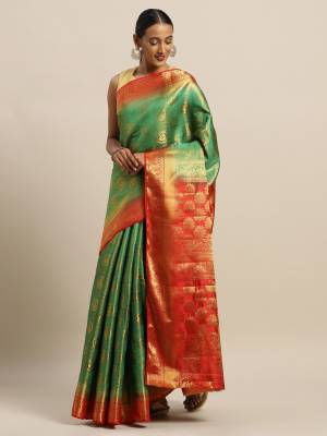 Celebrate This Festive Season Wearing This Pretty Silk Based Saree In Green Paired With Contrasting Red Colored Blouse. This Saree And Blouse Are Fabricated On Art Silk Beautified with Weave All Over. 