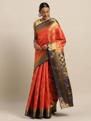 Rich And Elegant Looking Designer Silk Based Saree Is Here In Orange Color Paired With Contrasting Navy Blue Colored Blouse. This saree And Blouse Are Fabricated On Art Silk Which Gives A Rich Look To Your Personality. 