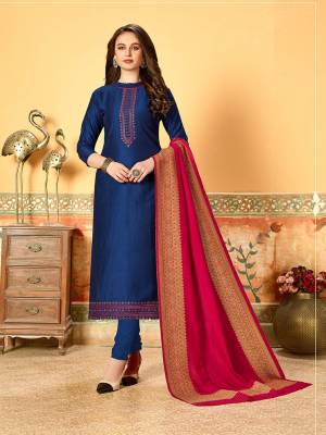 Grab This Very Beautiful Designer Dress Material In Royal Blue Color Paired With Contrasting Dark Pink Colored Dupatta. Its Pretty Embroidered Top Is Fabricated On Art Silk With Self Butti Paired With Santoon Bottom And Jacquard Cotton Silk Dupatta. Buy This Straight Suit Now. 