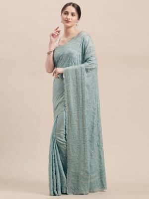 You Will Definitely Earn Lots Of Compliments Wearing This Heavy Designer Saree In Pastel Blue Color Paired With Pastel Blue Colored Blouse. This Pretty Saree And Blouse Are Fabricated On Georgette. This Saree Is Beautified With Heavy Detailed Tone To Tone Embroidery All Over. 