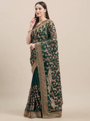 Get Ready For The Upcoming Wedding Season With This Heavy Embroidred Designer Saree In Dark Green Color. This Saree Is Fabricated On Georgette Paired With Art Silk Fabricated Blouse. By This Pretty Saree Now.