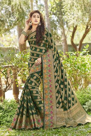 For A Proper Traditional Wear, Grab This Designer Silk Based Saree In Dark Green Color. This Saree And Blouse Are Fabricated On Art Silk Beautified With Attractive Detailed Weave. Buy Now.