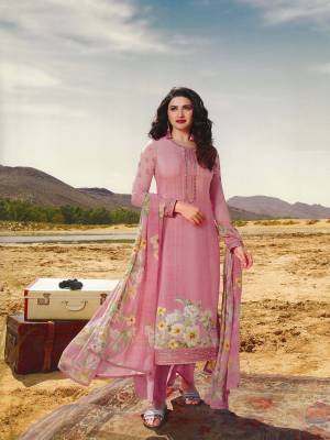 Celebrate This Festive Season With Beauty And Comfort Wearing This Designer Straight Suit In All Over Pink Color. This Suit Is Crepe Based Paired With Chiffon Fabricated Dupatta. It Is Beautified With Floral Prints And Embroidery Giving It An Attractive Look.