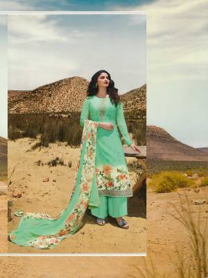 Celebrate This Festive Season With Beauty And Comfort Wearing This Designer Straight Suit In All Over Sea Green Color. This Suit Is Crepe Based Paired With Chiffon Fabricated Dupatta. It Is Beautified With Floral Prints And Embroidery Giving It An Attractive Look.